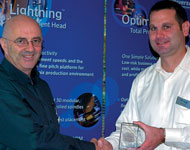 Zalman Orlianski receives the award from Brad Bennett, Universal’s director of European Operations